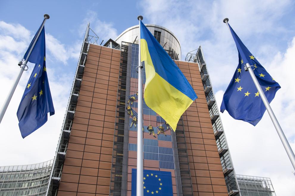 European and Ukrainian flags raised in front of the Berlaymont building to commemorate the second year of the Russian invasion of Ukraine